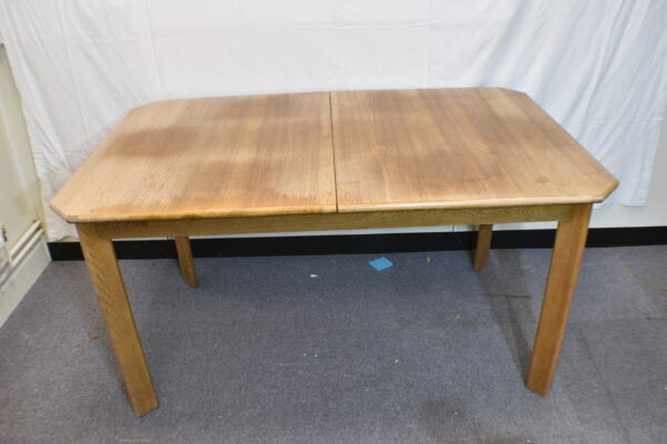 Large extending wooden dining table
