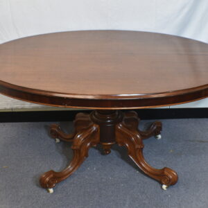 Dark wood round dining table