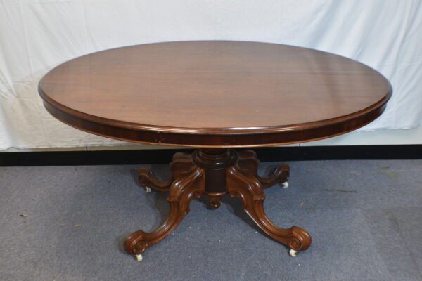 Dark wood round dining table