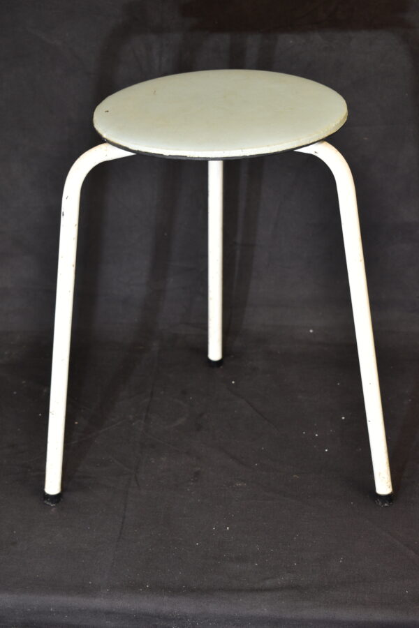 Cream topped three leg stool